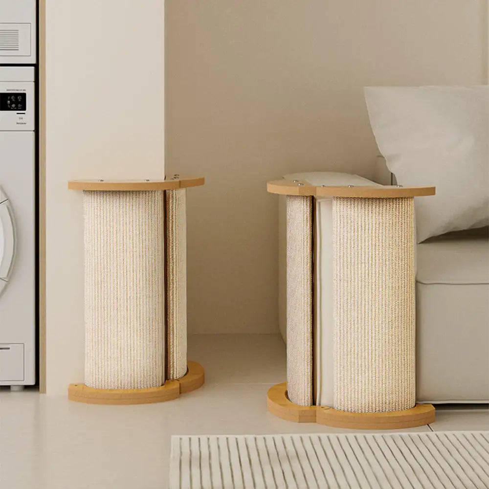 Two sisal cat scratch posts used at wall corner and beside sofa in modern home interior